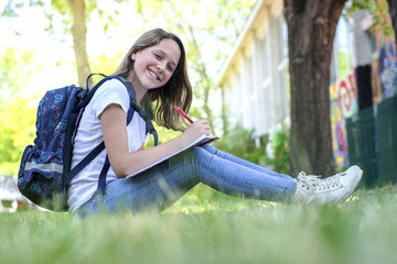 The girl solves a task for school