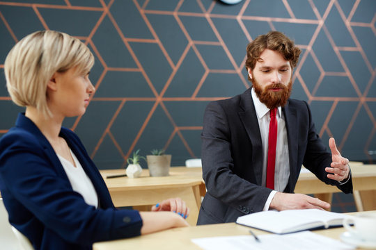 Female employee listening to ideas of her colleague