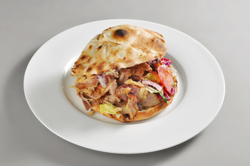 Round plate with a Kebab sandwich