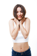Fototapeta premium Beautiful young woman having fun over white background.