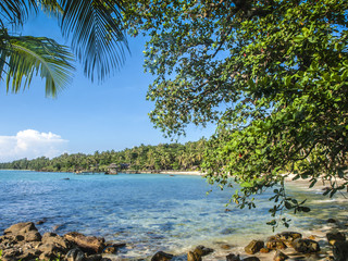 A tropical beach with palm trees on the island of ko Kut in the east of Thailand