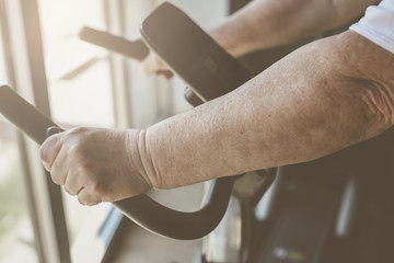 Close up of senior woman on the treadmill.