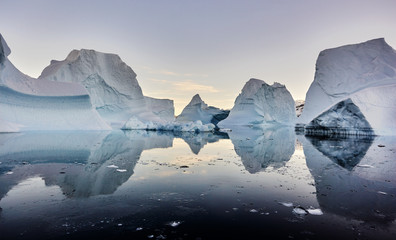 iceberg floating in greenland fjord