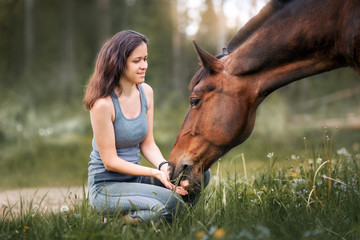 Young woman  with her horse - 163149159