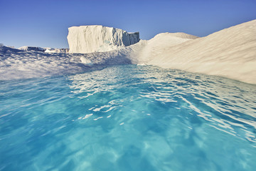 iceberg floating in greenland fjord - obrazy, fototapety, plakaty