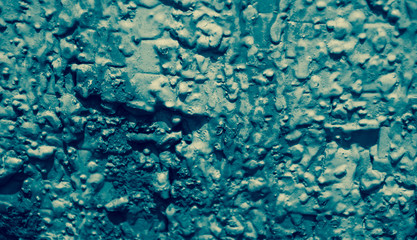 Fototapeta na wymiar Turquoise metal knobby surface. Vintage abstract background.