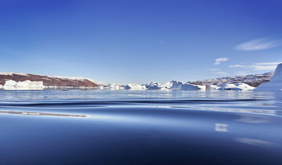Fototapeta na wymiar iceberg floating in greenland fjord