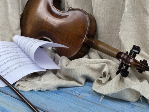 Ancient Violin On A Wooden Board. 