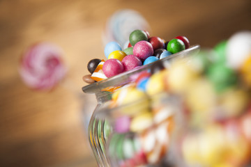 Fototapeta na wymiar Assorted candies including lollipops, gum balls