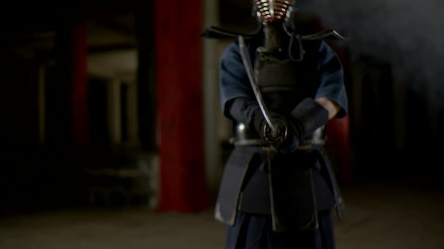 Kendo warrior demonstrates fighting attacks in slow motion