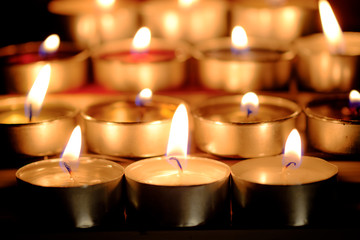 Selective focus and close Up Group of burning candles in thai style  and concept of peace, meditation and relaxation