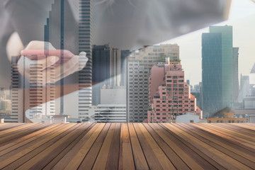 wooden floor and double exposure of business people using smartphone and city in background space for your text or object in photo, business concept.