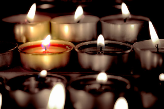 Selective focus and close Up Group of burning candles in thai style  and concept of peace, meditation and relaxation