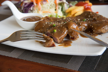 Steak and gravy on plate

