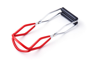 Naklejka premium Metal tongs lifting a homemade canning jar