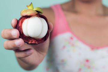 asian girl holding mangosteen, tropical fruit,healthy eating, dieting concept , .vegetarian food. - 163156168
