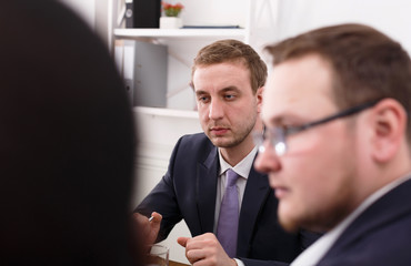 Business meeting. Young team in modern office, closeup portrait