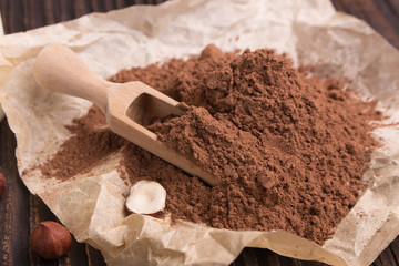 Chocolate heart-shaped candy on a rustic background, chocolate composition