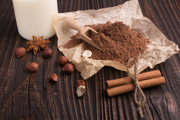 Chocolate heart-shaped candy on a rustic background, chocolate composition
