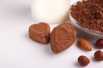 Chocolate heart-shaped candy on a white background, chocolate composition