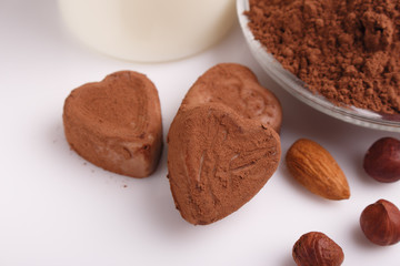 Chocolate heart-shaped candy on a white background, chocolate composition