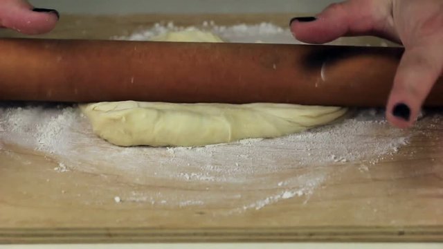 The process of preparing dough for pizza or ravioli.