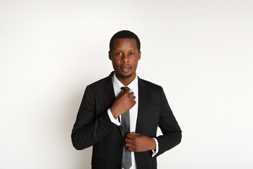 Handsome african business man posing isolated