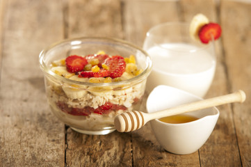 oatmeal porridge with strawberry and banana in a bowl