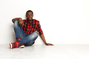 Happy smiling black man in casual at studio background