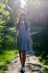 beautiful red-hair girl in the outdoors
