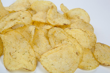 bunch of fried potato chips on white