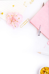 Workplace mockup with pink leather notebook and golden accessories on white background top view. Flat lay with copy space.  Feminine working style concept.