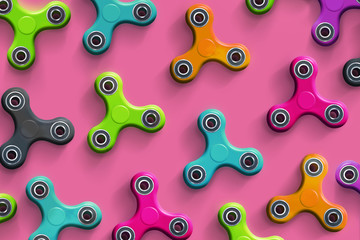 Fidget spinners on the pink background 3D illustration