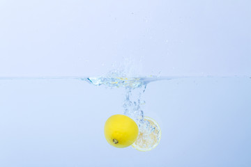 Lemon splashing in water
