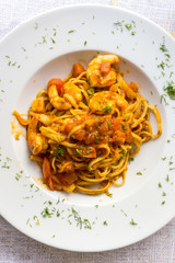 close-up of plate of pasta and Shrimp with lettuce