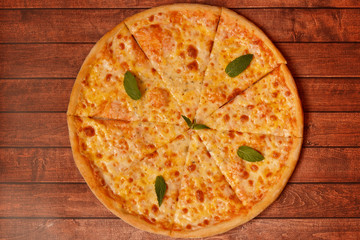 Pizza with cheese on the board