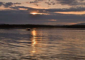 Boat on the water at sunset