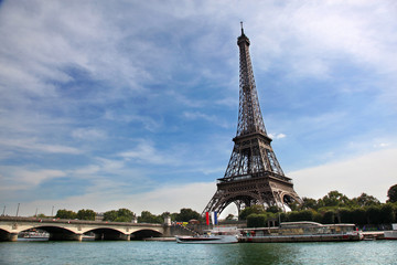 Fototapeta na wymiar Iconic view of Eiffel Tower across the River Seine