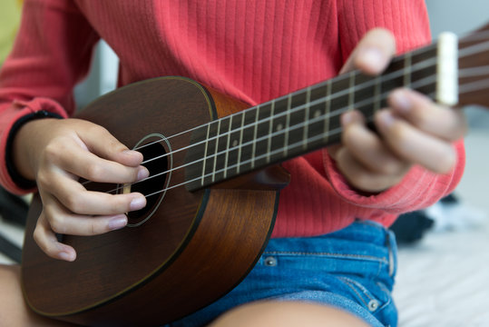 Hand playing ukulele