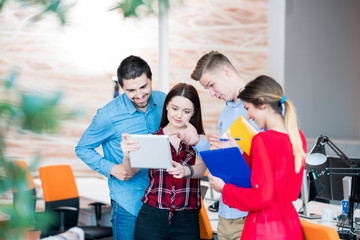 business, startup and people concept - happy creative team in office