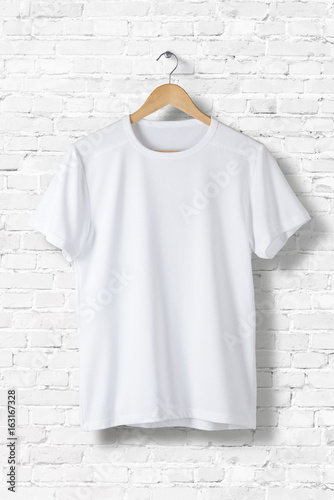 Download "Blank White T-Shirt Mock-up hanging on white wall, front ...