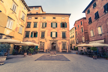 Fototapeta na wymiar Restaurants on historic streets of Lucca,Tuscany,Italy
