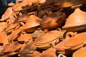 selection of tagine pottery on market in morocco