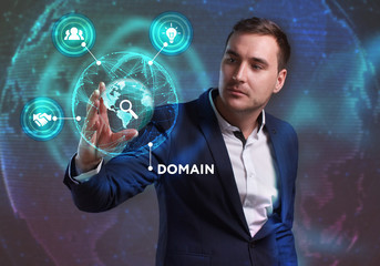 Business, Technology, Internet and network concept. Young businessman working on a virtual screen of the future and sees the inscription: Domain