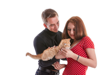 Young couple with a kitten.