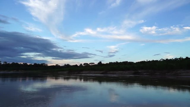 Sailing the river at dusk