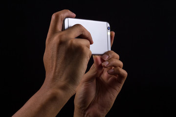 Photographer holding Smart phone on black background