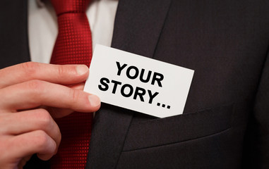 Businessman putting a card with text Your Story in the pocket