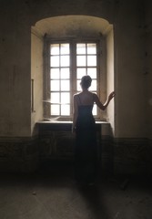 woman in an abandoned ancient castle