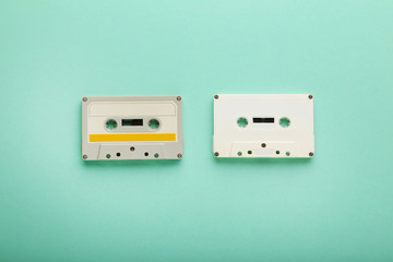White cassette tapes on mint background